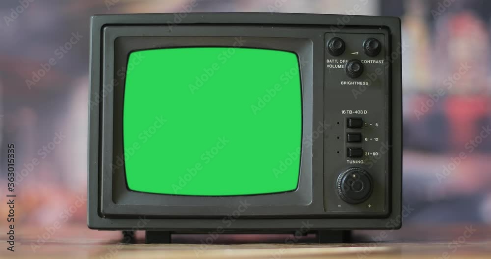 Old tv. Vintage Television set green background with noise and static. Green screen.