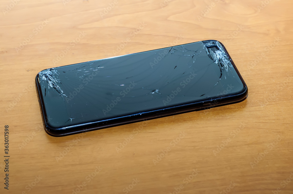 View on a cracked screen of a smartphone View on a cracked screen of a smartphone