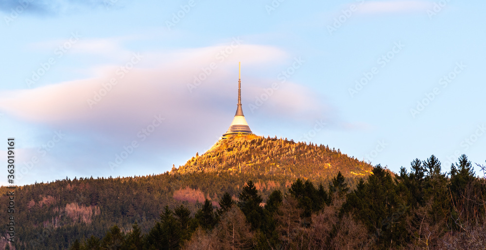 Jested Mountain with modern hotel and transmitter on the top. Extraordinary view from Krizany, Czech Republic Jested Mountain with modern hotel and transmitter on the top. Extraordinary view from Krizany, Czech Republic