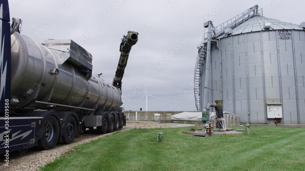 Truck Connecting Pipe To Slurry Tank On Farm Truck Connecting Pipe To Slurry Tank On Farm