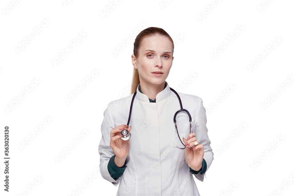Beautiful young woman doctor in a white medical coat looking at the camera. Beautiful young woman doctor in a white medical coat looking at the camera.