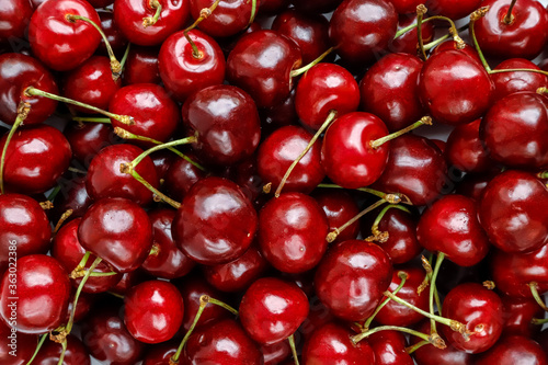 Ripe red sweet cherries top view, background