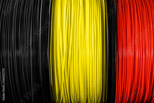 Belguim flag of the coils for 3D printer. Filament for 3d printing, Bright thermoplastic of black, yellow and red