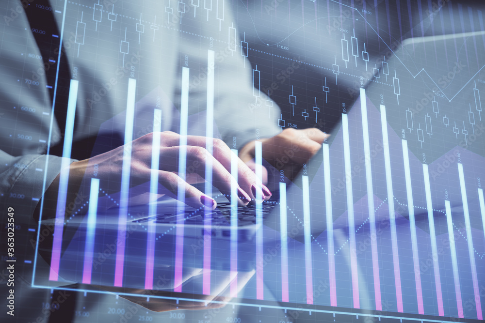 Double exposure of businesswoman hands typing on computer and forex chart hologram drawing. Financial analysis concept. Double exposure of businesswoman hands typing on computer and forex chart hologram drawing. Financial analysis concept.