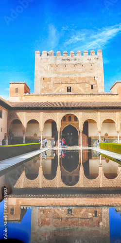 Arabic style buildng and interior garden with reflecting pool photo