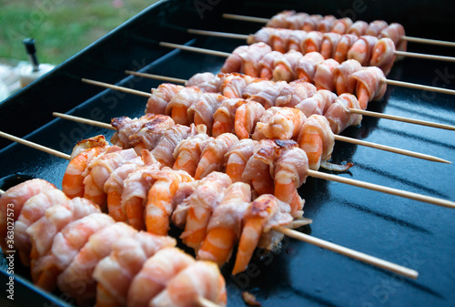 Bacon wrapped shrimp on grill