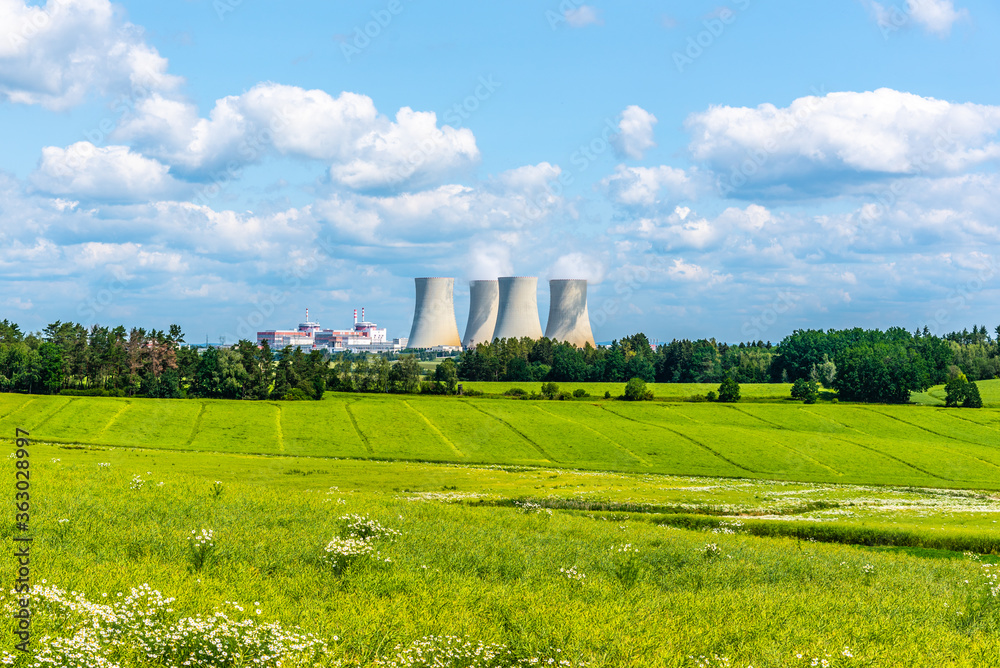 Nuclear power plant on the background of beautiful green summer meadow. Temelin, Czech Republic
