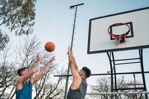 Young basketball players playing one-on-one. © Mego-studio