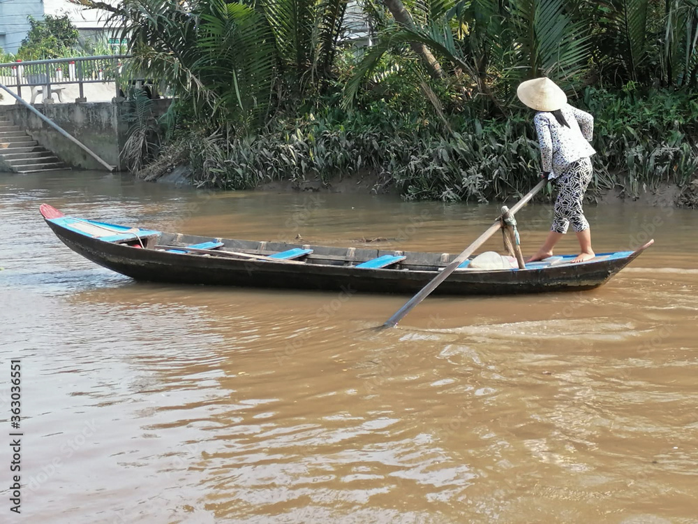 Mekong Delta, Vietnam - February 26, 2020: The Mekong Delta in Vietnam is a vast maze of rivers, swamps and islands, floating markets. Boats are the main means of transportation.