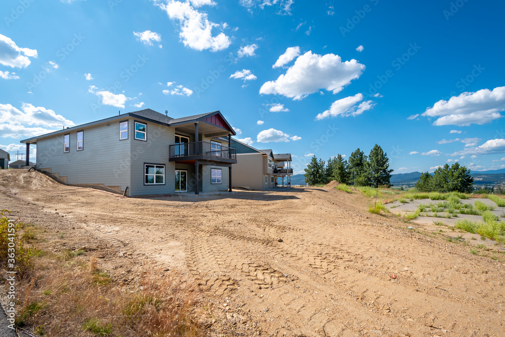New upscale hillside homes under construction in an American subdivision in Spokane, Washington, USA New upscale hillside homes under construction in an American subdivision in Spokane, Washington, USA