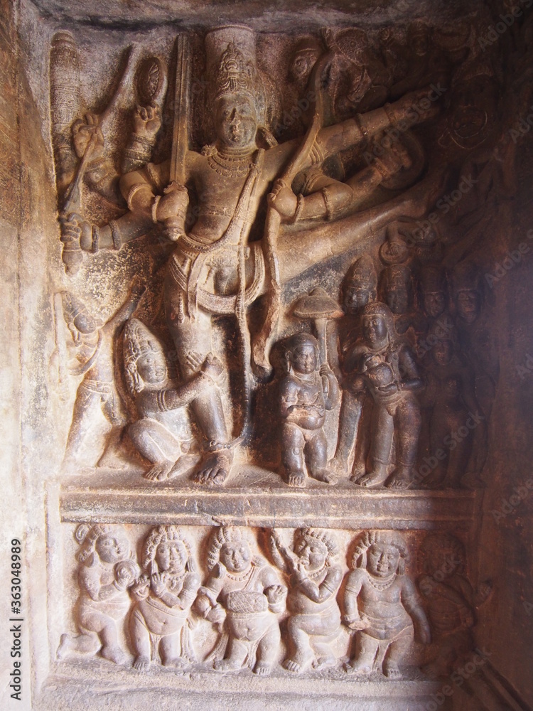 A stone statue dug into a rock, Cave Temples, Badami, Karnataka, South India, India A stone statue dug into a rock, Cave Temples, Badami, Karnataka, South India, India
