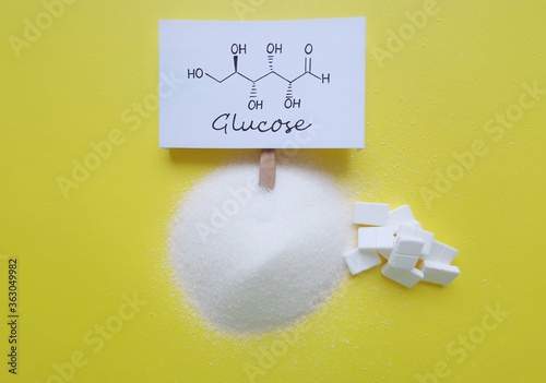 фотографія Structural chemical formula of glucose with refined crystalline sugar and cube sugar