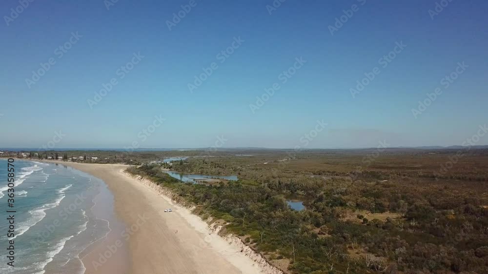 Aerial Drone Over Secluded Countryside And Sandy Beach Coastline With Blue Waves On Sunny Day In Australia Aerial Drone Over Secluded Countryside And Sandy Beach Coastline With Blue Waves On Sunny Day In Australia