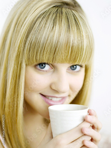 A woman with a cup of coffee