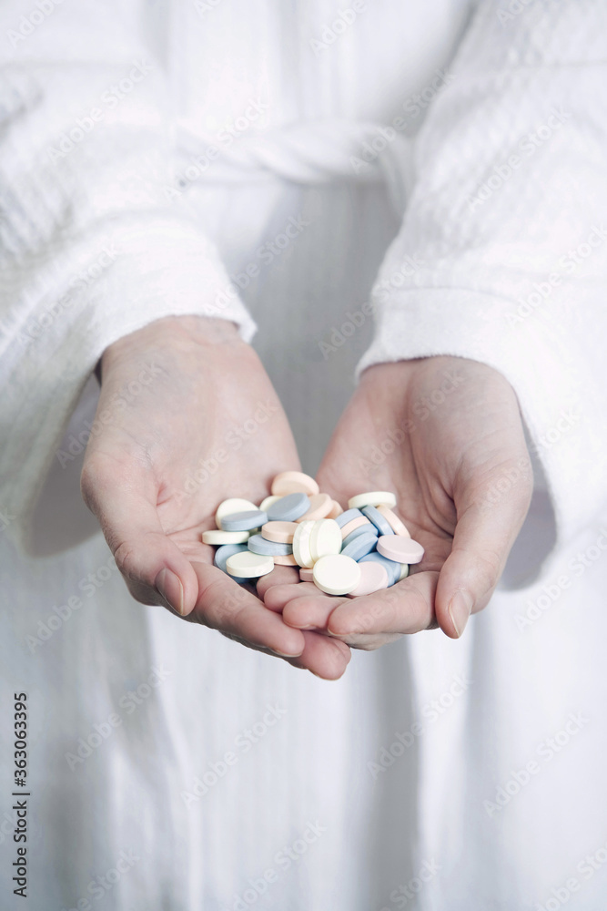 Hands with pills Hands with pills