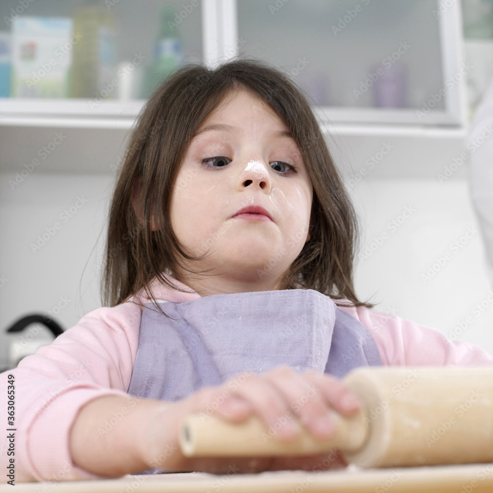 Girl with flour on her nose using rolling pin Stock Photo Adobe Stock