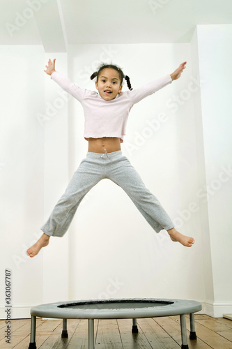Fototapeta Naklejka Na Ścianę i Meble -  Kid jumping happily