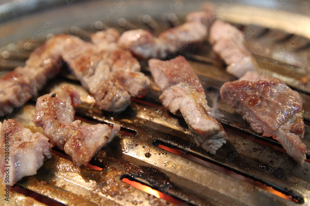 Korean grilled pork BBQ (Samgyeopsal-gui) with charcoal at Korean restaurant, Busan, South Korea Korean grilled pork BBQ (Samgyeopsal-gui) with charcoal at Korean restaurant, Busan, South Korea