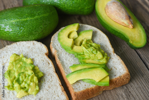 avocado dip mashed - avocado sliced and avocado toast fruits healthy food concept