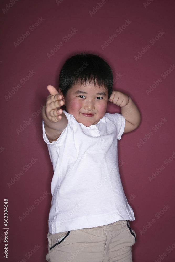Boy's hand in fist, about to throw a punch Boy's hand in fist, about to throw a punch