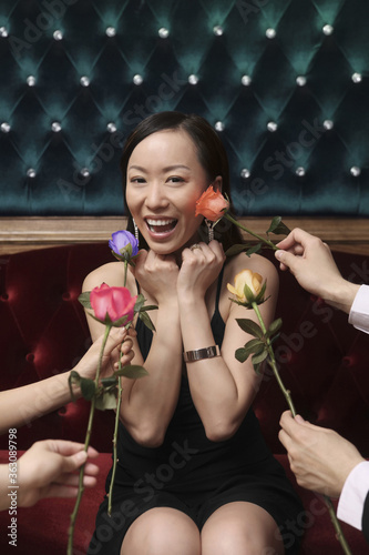 Woman looking excited being showered with roses