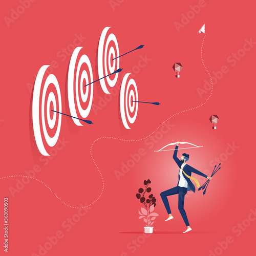 Successful businessman hit many target with bow and arrow-Business success concept