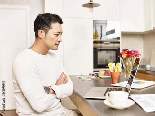 young asian business man working from home
