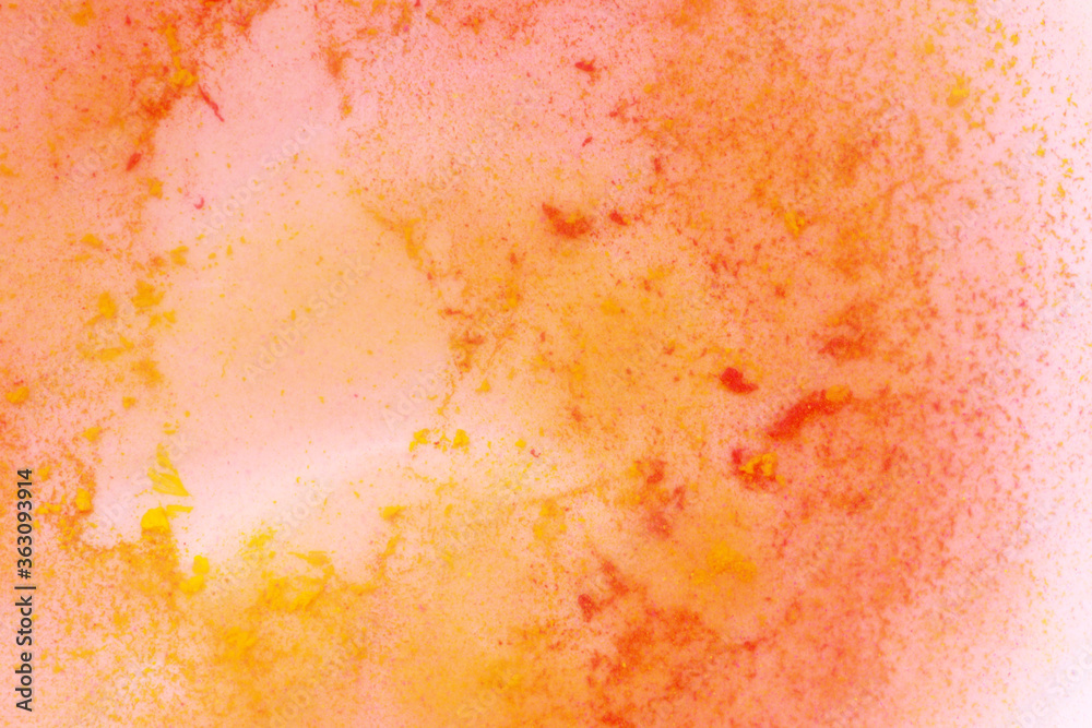 yellow and red paint in water