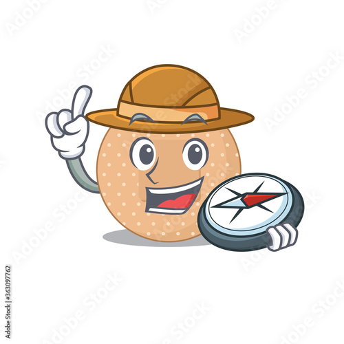 Rounded bandage mascot design style of explorer using a compass during the journey