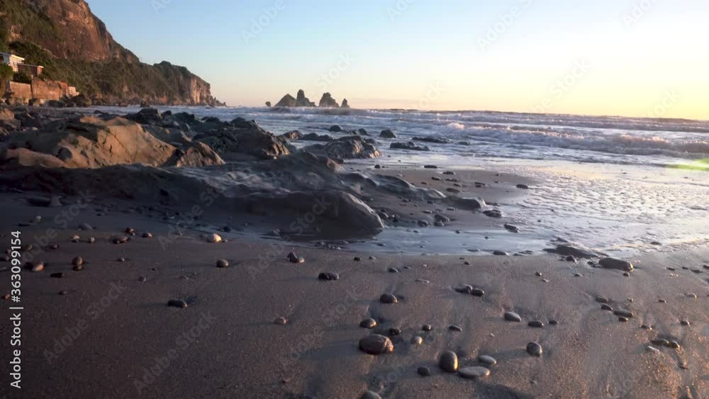 Motukiekie Beach on the West Coast of New Zealand's South Island at sunset Sliding shot from left to right Motukiekie Beach on the West Coast of New Zealand's South Island at sunset Sliding shot from left to right
