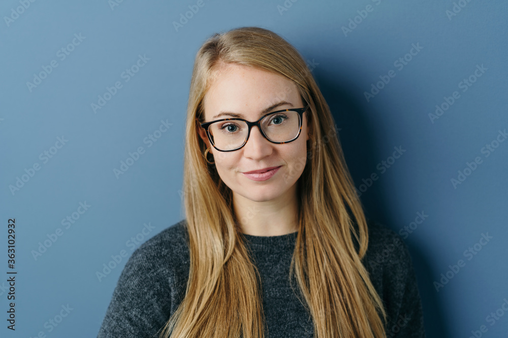 Attractive blond woman looking pensively at camera Attractive blond woman looking pensively at camera
