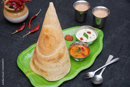 Dosa, ghee roast with coconut chutney  and sambar popular South Indian Breakfast, Kerala, Tamil Nadu India. Top view of Masala dosa, a type of pancake stuffed with potato and tomato curry side dish. photo