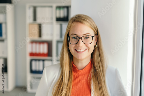 Tableau sur toile Friendly businesswoman with welcoming smile