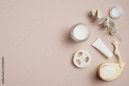 Natural organic SPA beauty products and eco-friendly bathroom accessories on beige background. Flat lay, top view. Body care concept.