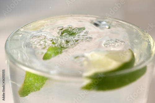 Refreshing lemonade with slices of lime