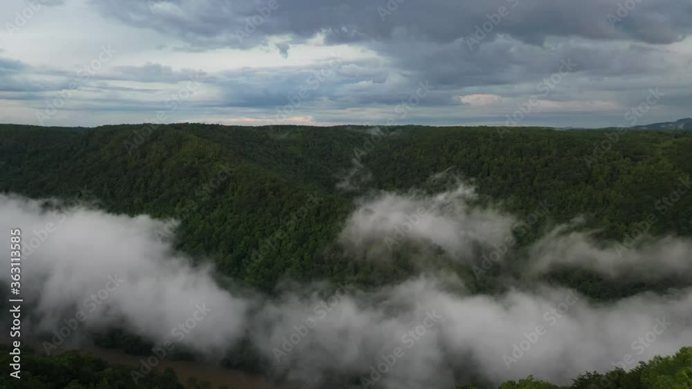 Flying Above Forest and Clouds in New River Gorge Canyon, Appalachian Mountains, West Virginia USA Flying Above Forest and Clouds in New River Gorge Canyon, Appalachian Mountains, West Virginia USA