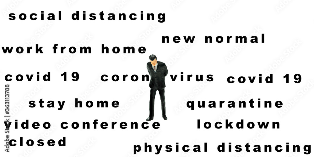 Miniature businessman standing with corona virus crisis wording, business concept. Miniature businessman standing with corona virus crisis wording, business concept.