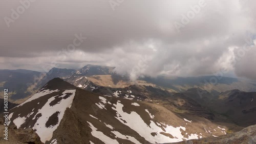 Rolling clouds over Mount Mulhacen as seen from Veleta, Sierra Nevada, Spain. Scenic time-lapse photo