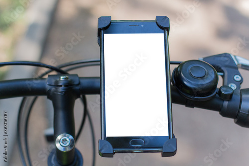 smartphone on the handlebars of a bicycle
