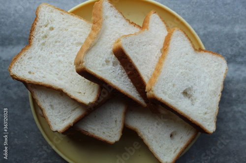 Brown white color raw bread pieces cropped and partial display with selective focus. Food background.