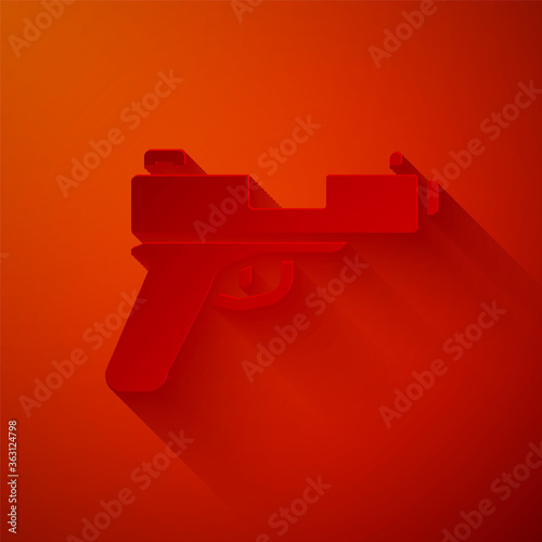 Paper cut Pistol or gun icon isolated on red background. Police or military handgun. Small firearm. Paper art style. Vector.