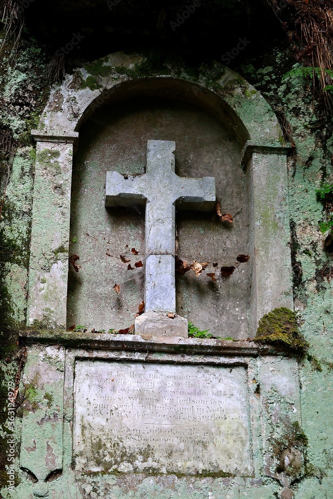 rock chapel in the rocky slope of the river Kamenice, faith in God carved into the rock, Hrensko, Czech Republic
