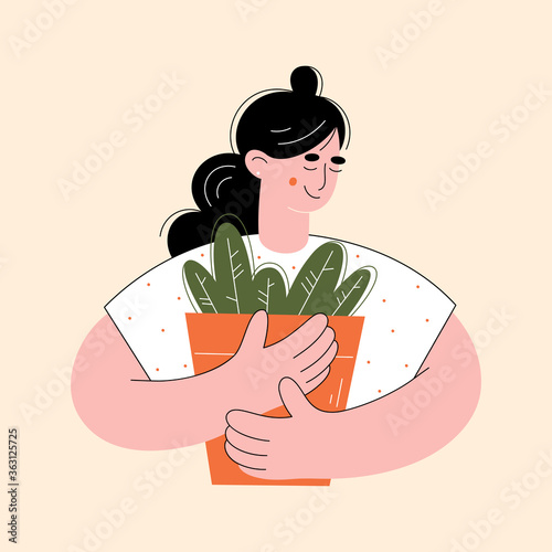 Young woman gardener. Girl florist. Home plants. Gardening concept. 