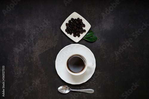 Cup of coffee and Coffee composition on black background. Copy space. Top view. Flat lay.