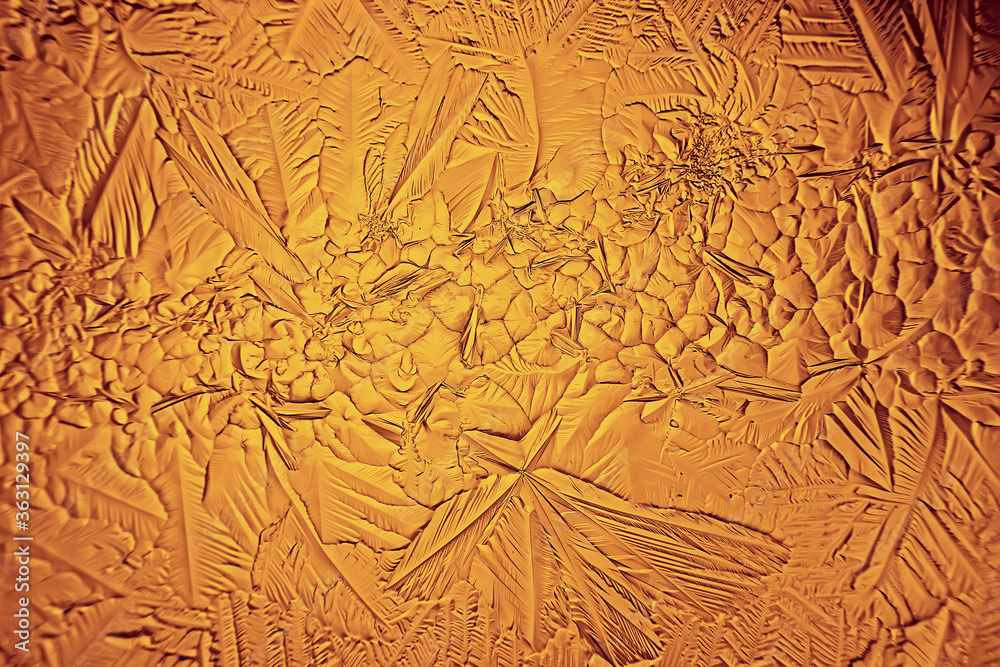 Obraz premium golden ice background, abstract yellow background, cold seasonal unusual ice, holiday texture