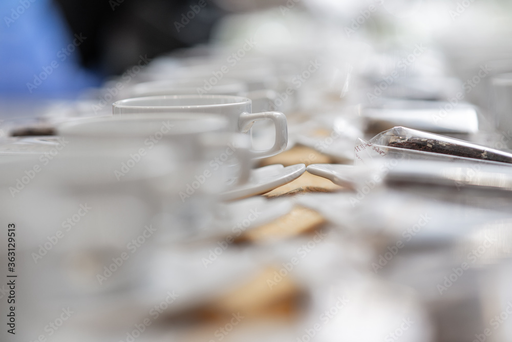 row of empty cups of coffee row of empty cups of coffee