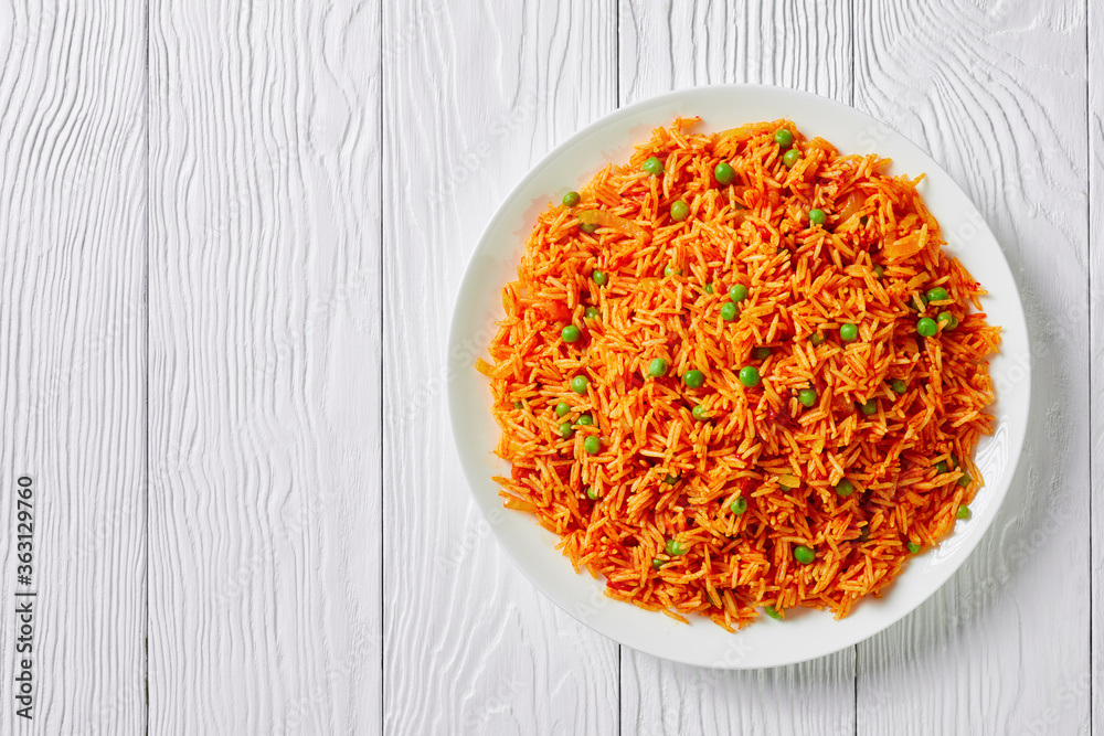 Tomato onion green peas rice on a plate Tomato onion green peas rice on a plate