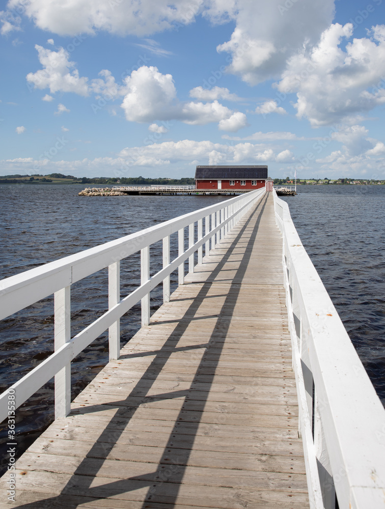 Fototapeta premium white bridge going out into the water