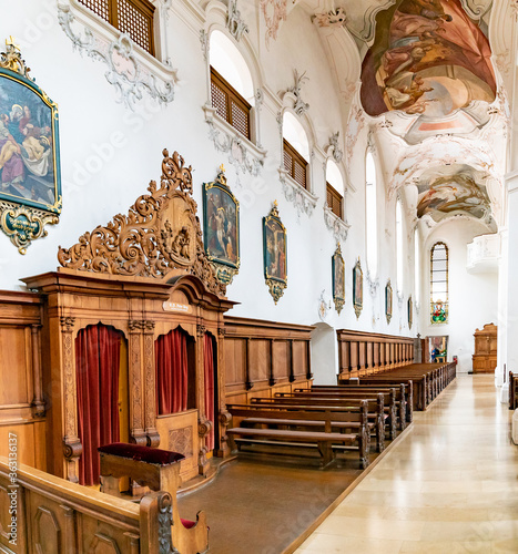 interior view of the St. Fridolin cathedral in Bad Saeckingen with the confessional photo