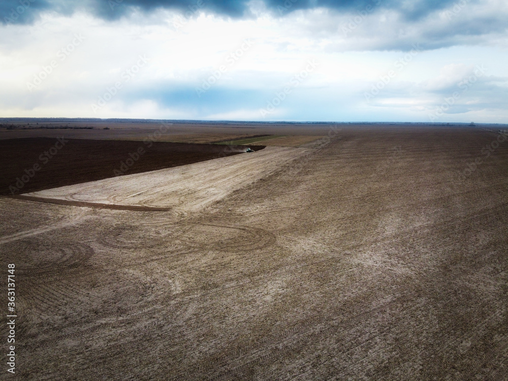 Agricultural machinery in the field, aerial view. Agricultural work. Agricultural machinery in the field, aerial view. Agricultural work.